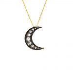 Gold, diamond moon pendant necklace. A beautiful moon-shaped 9ct yellow gold pendant, plated with black rhodium and set with stunning diamonds. The pendant hangs from an adjustable 9ct gold chain. 