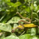 9ct yellow gold snake pendant with ruby eyes