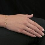 Yellow gold infinity bracelet