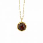 Yellow gold garnet pendant