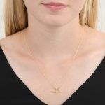 Yellow gold open star necklace