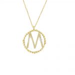 A single bright diamond set in an M initial yellow gold pendant. The letter M sits in a 9ct gold twisted circle and hangs from an adjustable gold chain. 