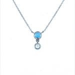 Beautiful blue topaz and moonstone pendant set into 9ct white gold hanging from an adjustable white gold chain.