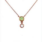 Beautiful 9ct rose gold bubble pendant. Two bright peridot and moonstone precious stones set into a rose gold pendant with an adjustable rose gold chain.