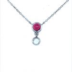 Beautiful 9ct white gold pink tourmaline and moonstone pendant. Bright pink and white gems set into 9ct gold attached to white gold adjustable chain. 