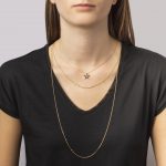 Layered gold chain and diamond star necklace set